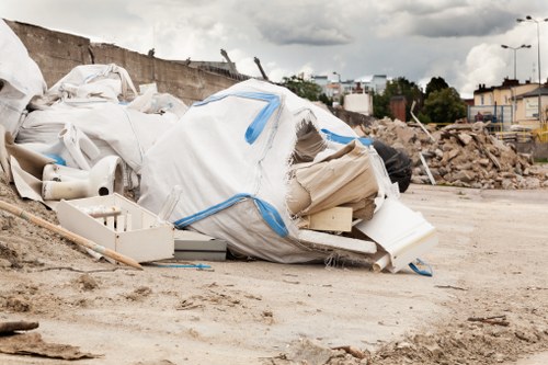Workers conducting a site safety briefing before rubbish collection
