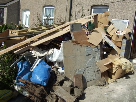 Workers managing construction debris